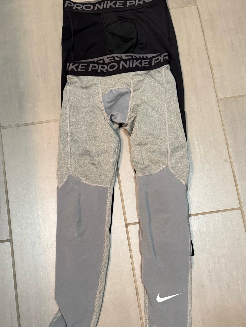 Nike Pro Kids' Compression Leggings - Dri-FIT Fit.  2 pair, 1 black, 1 gray.